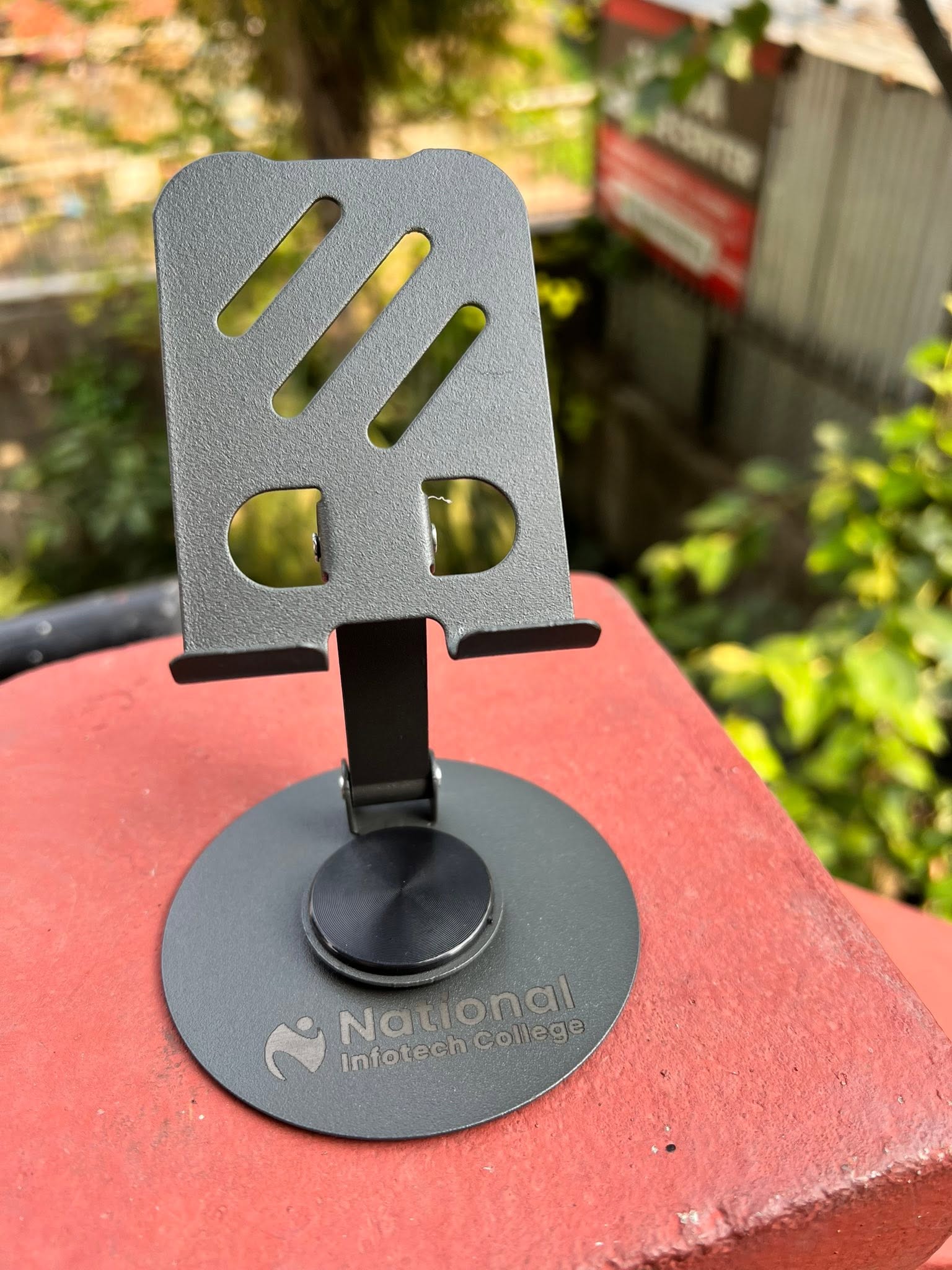 Laser engraved metal phone stand with custom name
